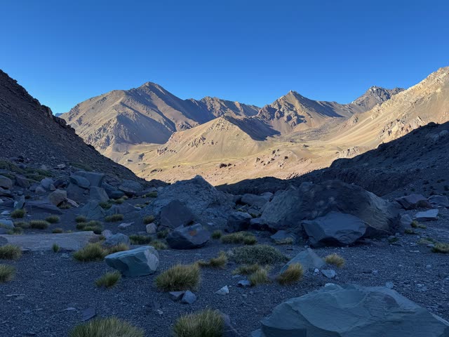 Rocky mountain valley with sparse vegetation