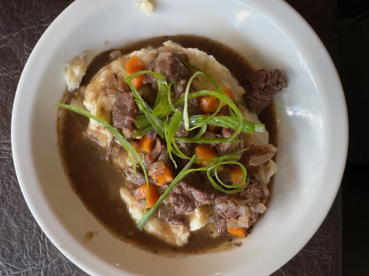 Bowl of hearty beef stew with vegetables