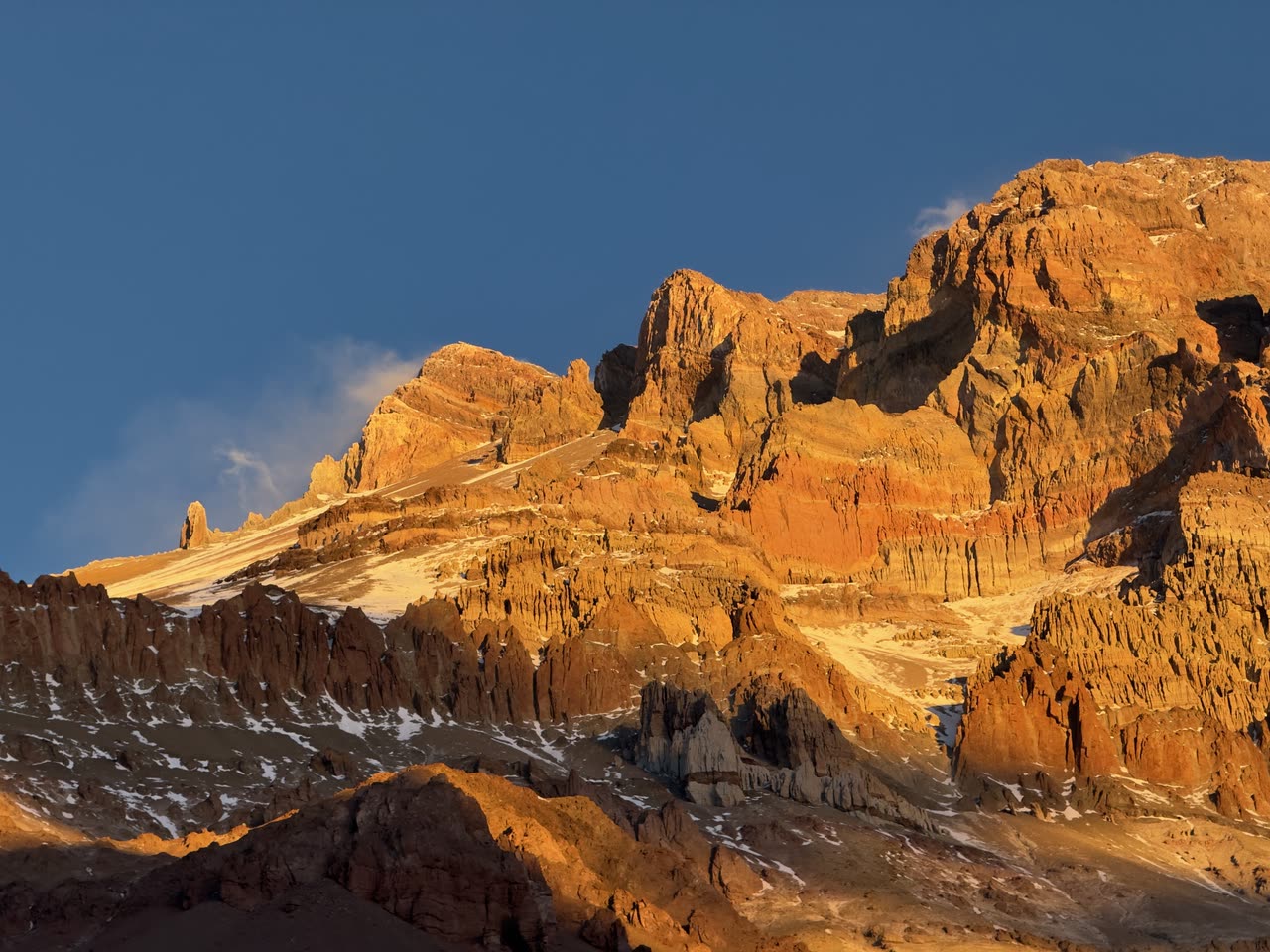 Sharp jagged peaks lit by golden sunset