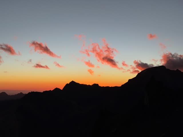 Fading sunset sky over mountains