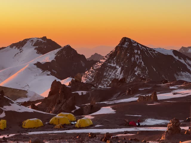 Tents on a ridge at sunset