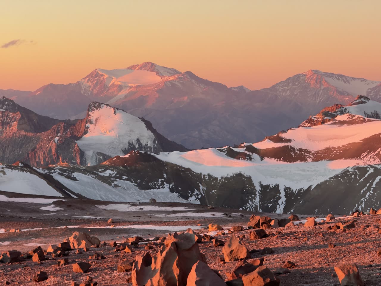 Purple and orange light over vast mountain horizon