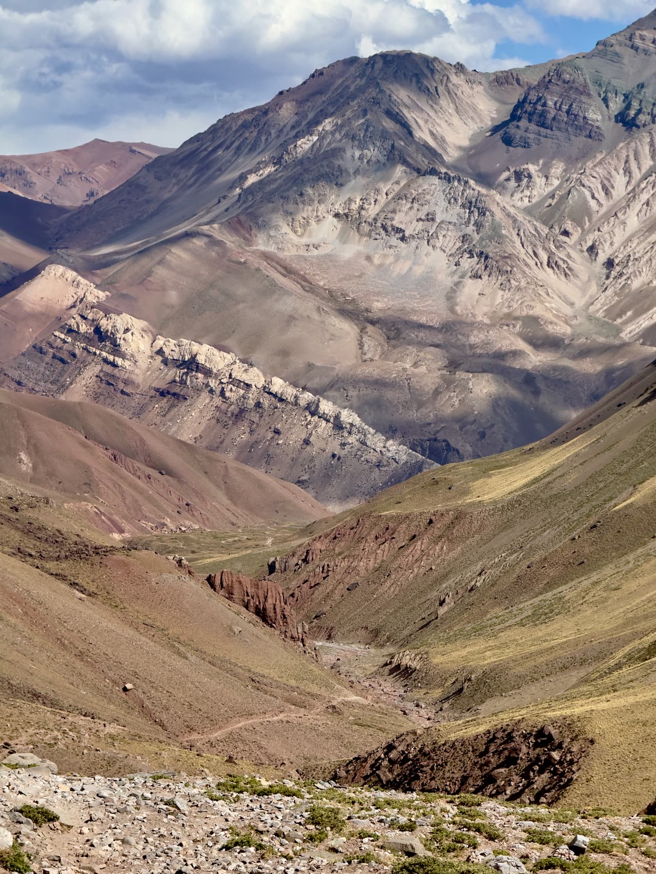 View down a long deep valley between towering peaks