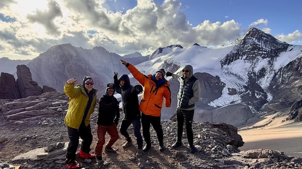Group of climbers posing on a snowy slope