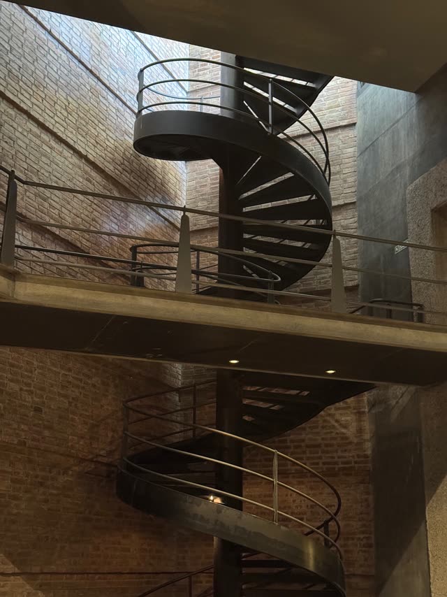 Modern metal spiral staircase in winery