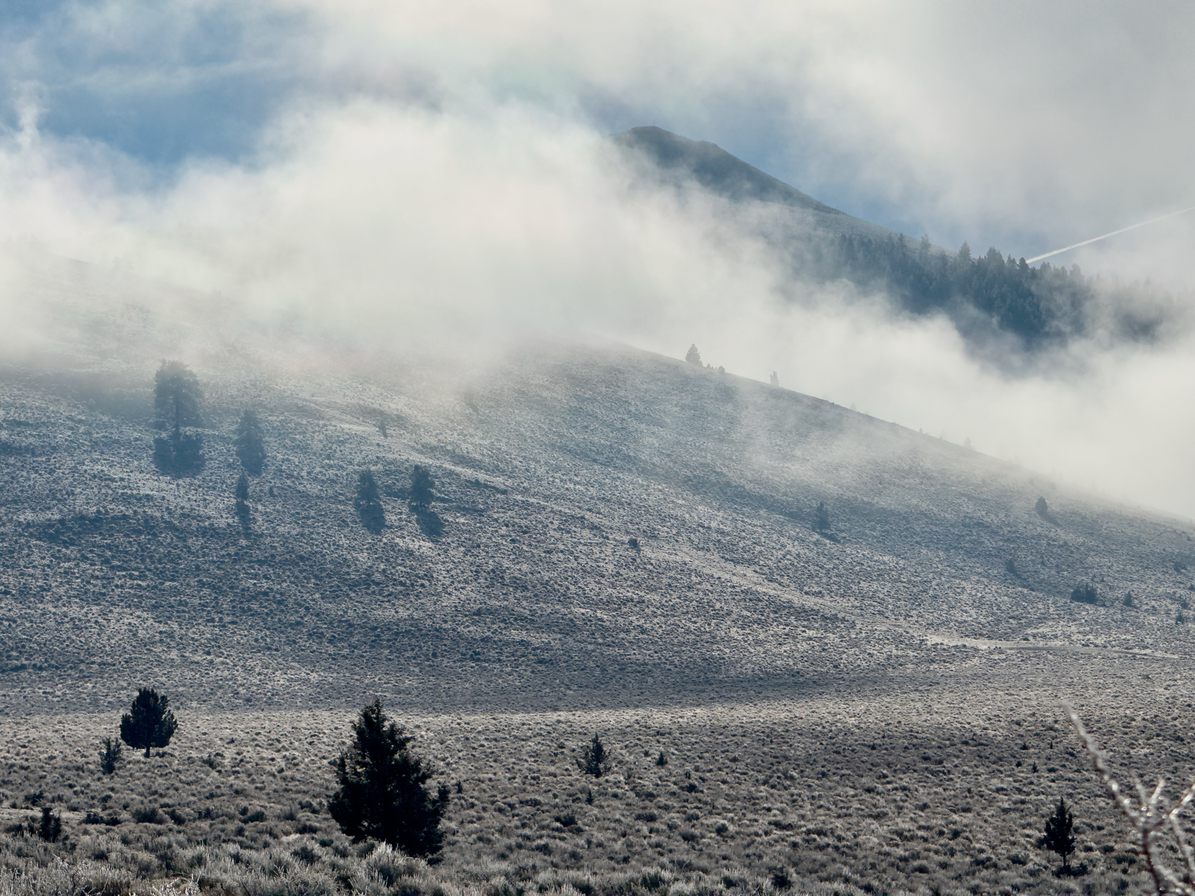 Clouds sliding across the slope