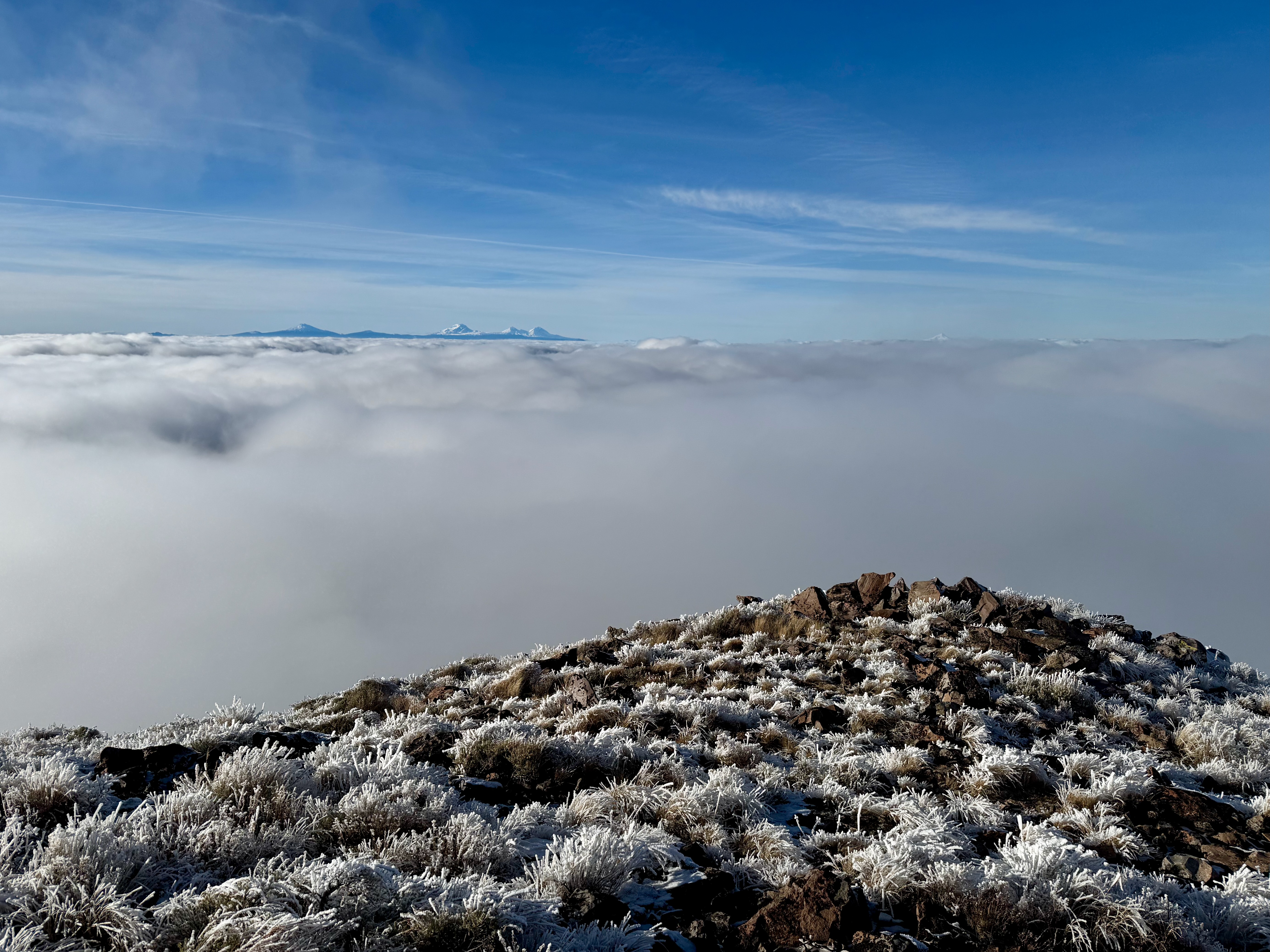 Rounded summit bump with clouds all around